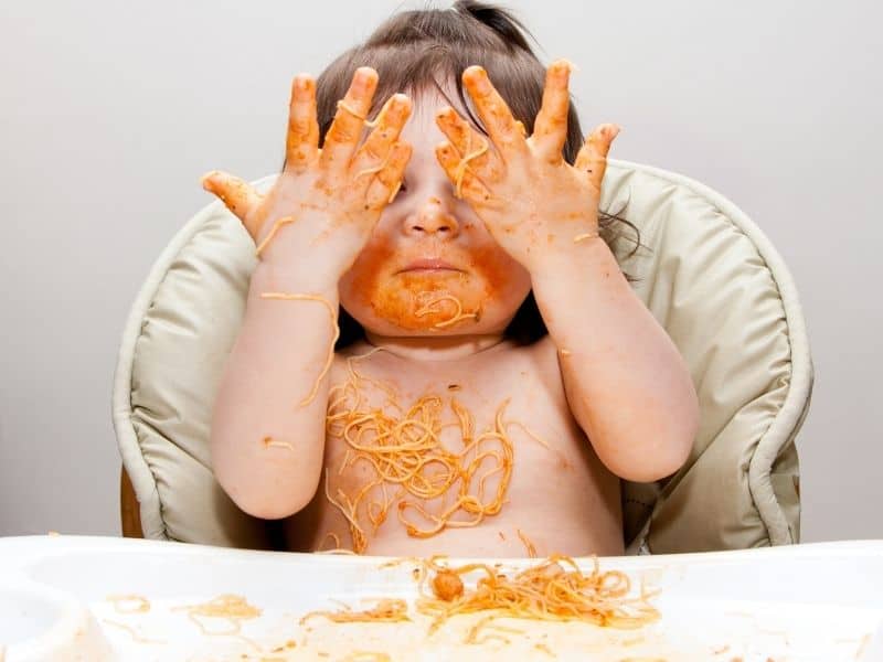 image of child eating spaghetti